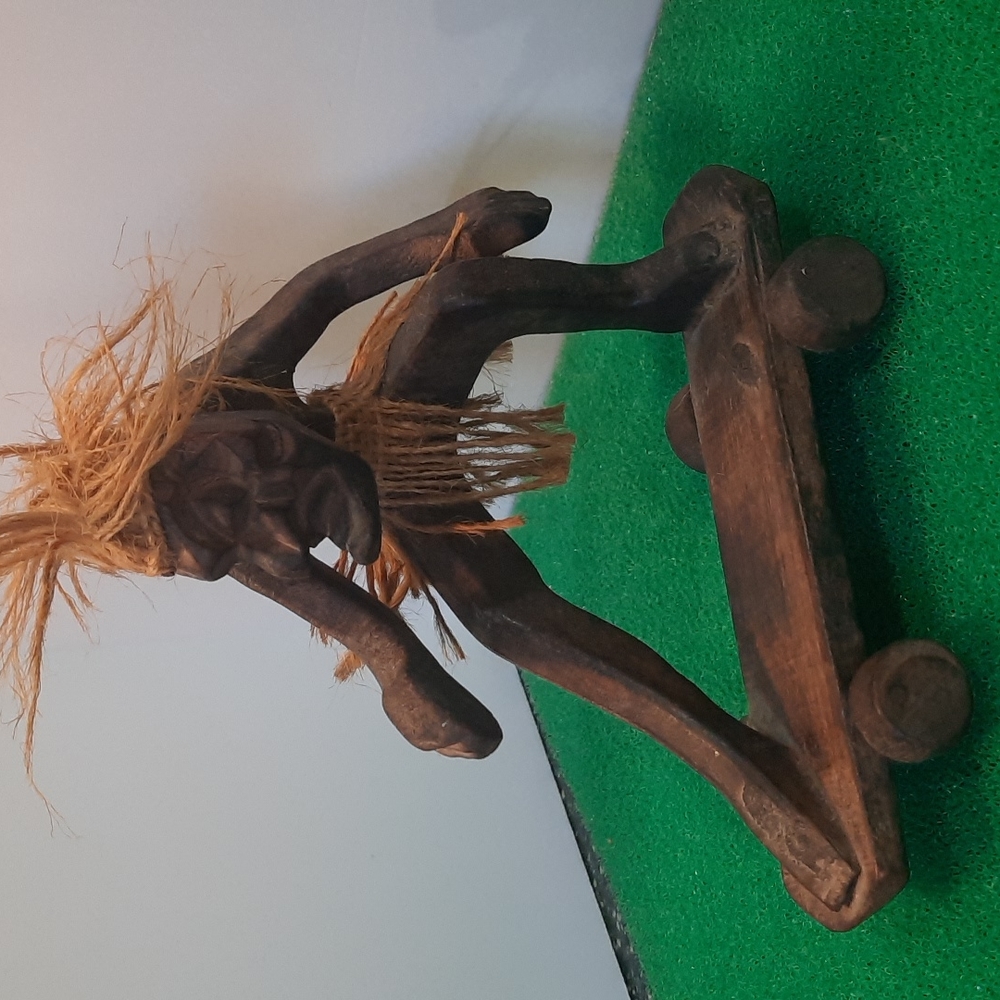 Hand carved wooden Hawaiian Tiki skateboard dude
